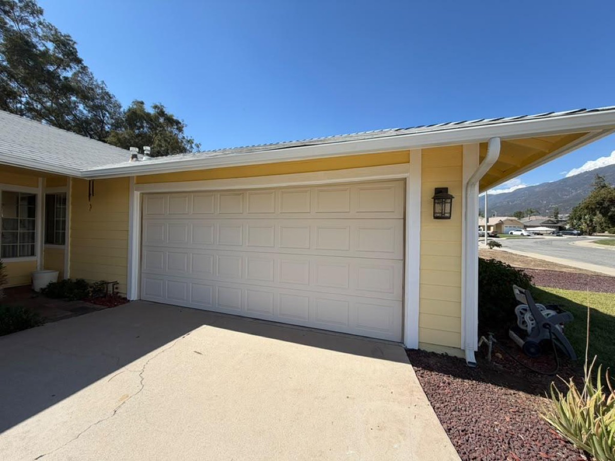 After: Garage — gutter run & downspout
