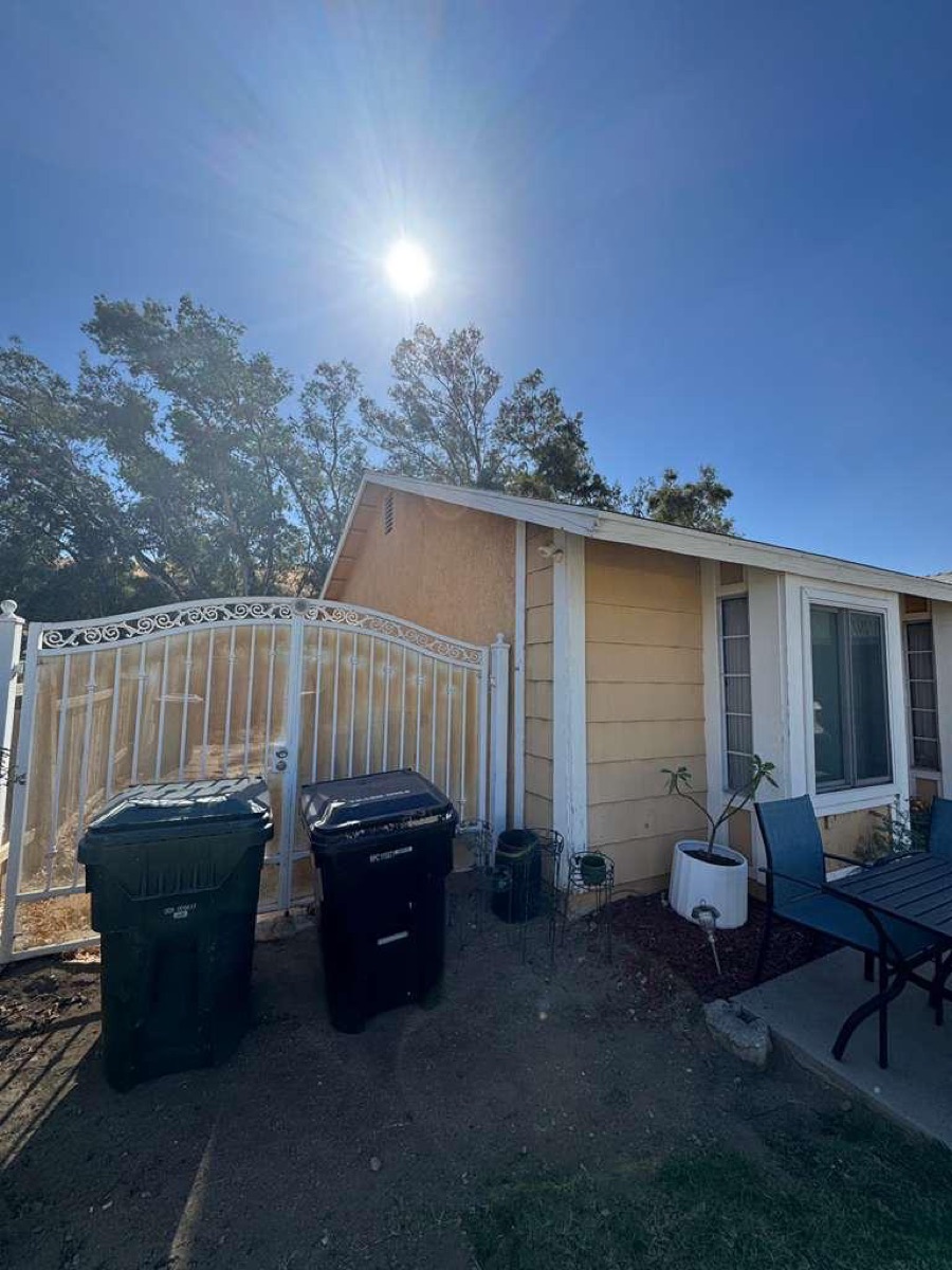 Before: Side yard — seamless gutter & downspout