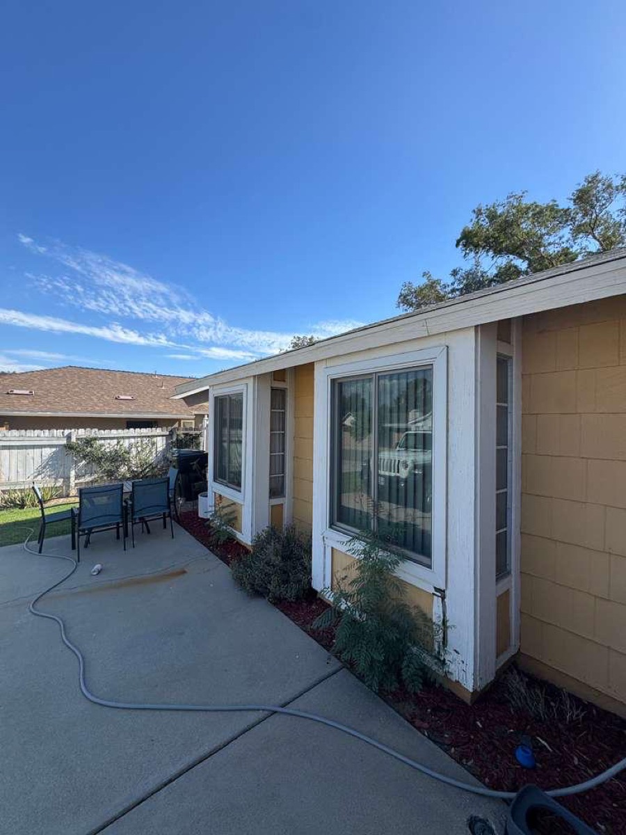 Before: Patio side — new white gutters & trim