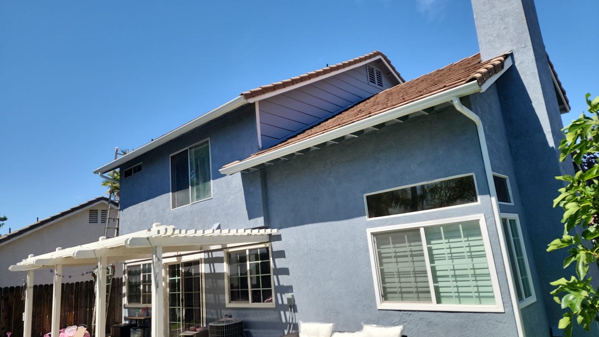 After: Two-story home — full gutter system (front before, back after)